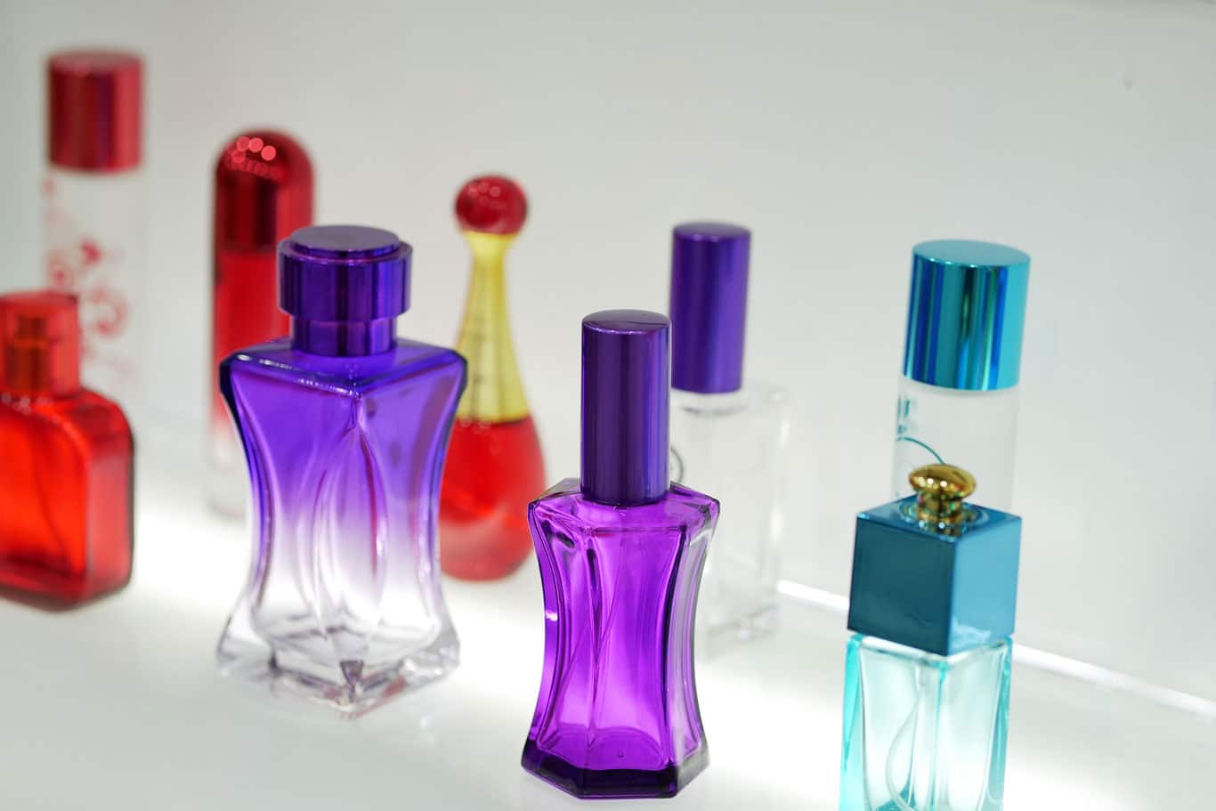 OK-multicolored-perfume-bottles-blurred-background